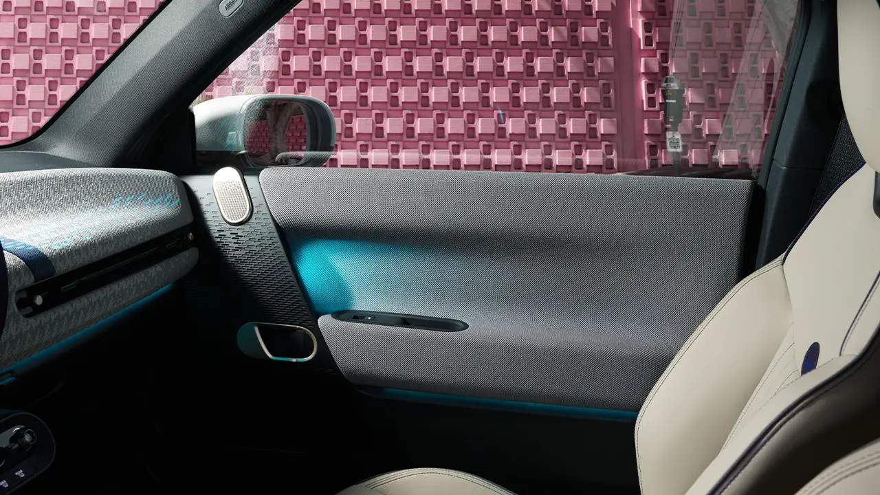 Interior view of all-electric MINI Cooper door with ambiente illumination
